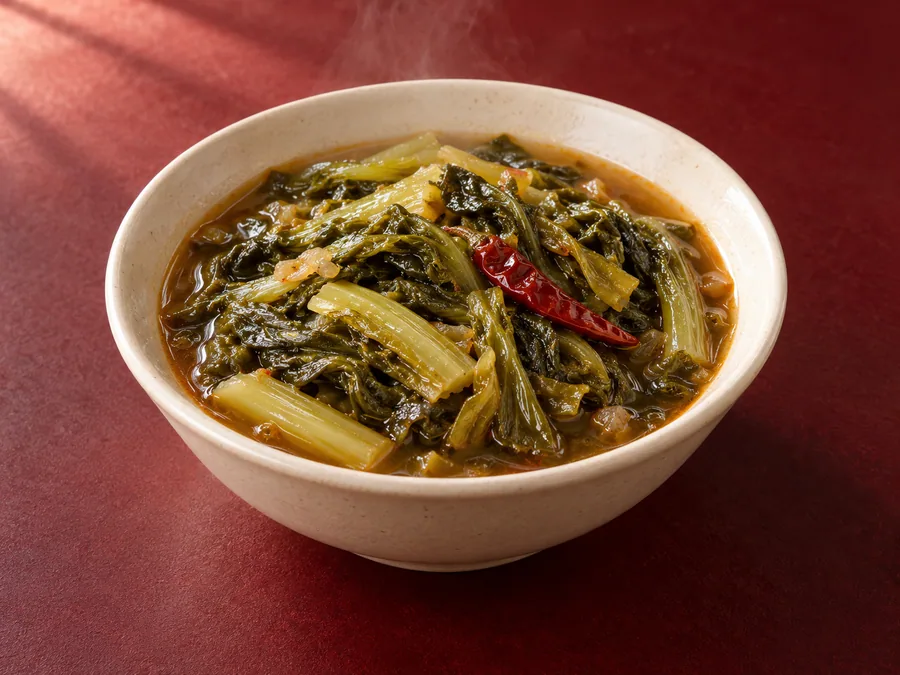 Hot and sour mustard greens, kai choy — illustrative image